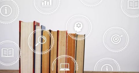 Worn hardcover books standing with learning icons overlay for education materials