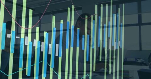 Business professional analyzing data with graph technology overlay
