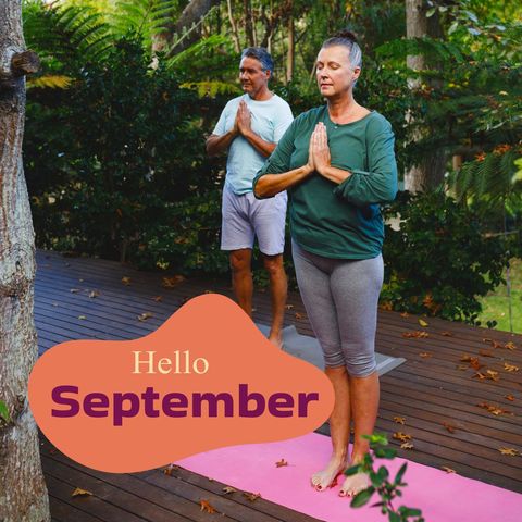 Caucasian couple practicing yoga outdoors with hello september graphic