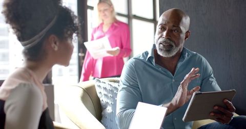 Businessman Discussing Strategies in Modern Office