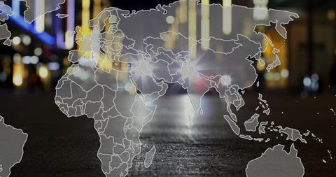 Translucent World Map Overlayed on Bustling City Street at Night
