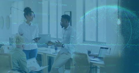 Team discussing data-driven strategy with immersive analytics overlay in modern office