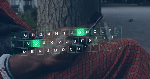 Holographic keyboard overlay showing virtual typing on smartphone resting on lap in park