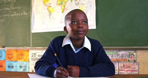 Young African Schoolboy Engaged in Classroom Activity