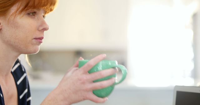 Woman with Red Hair Relaxing with Coffee Mug in Hand - Download Free Stock Images Pikwizard.com