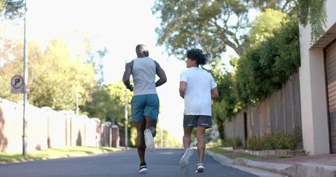 Diverse friends jogging together enjoying outdoor exercise