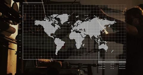 Grinding machinist in metal shop with digital world map overlay