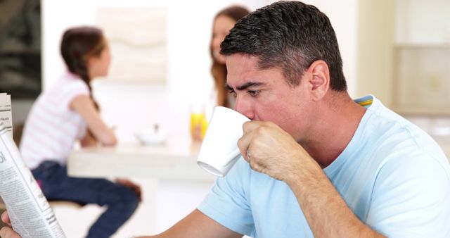 Father Drinking Coffee While Reading Newspaper - Download Free Stock Images Pikwizard.com