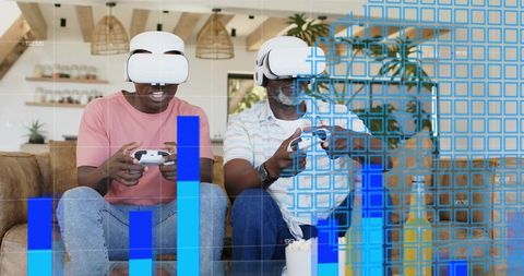 Playing virtual reality games together on couch with controllers and blue data overlay