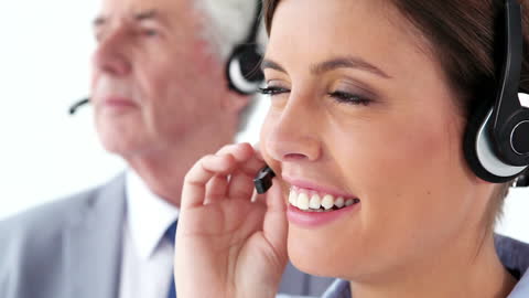 Customer Service Representatives Smiling With Headsets
