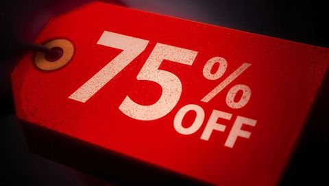 Displaying red sale tag showing 75% off closeup discount label with grommet and cord