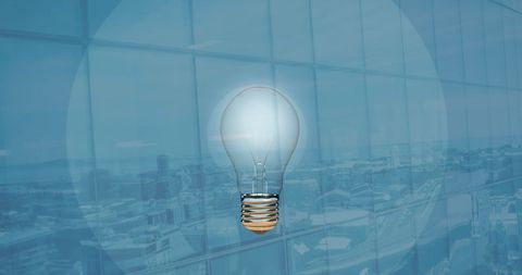 Creative innovation concept with light bulb and office background
