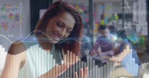 Businesswoman Uses Tablet with Animated Data Visualizations in Modern Office