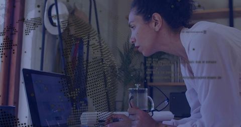 Focused Woman Coding on Laptop at Digital Workspace