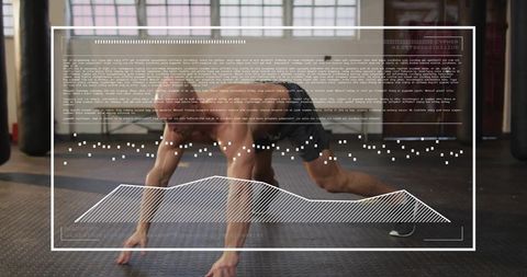 Athlete performing bear crawl on rubber gym floor with HUD overlay and hanging heavy bags