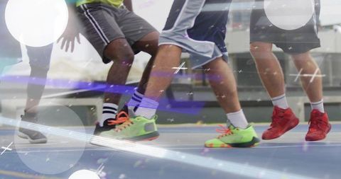 Fast footwork on indoor basketball court with neon sneakers, crew socks, fast-paced motion blur