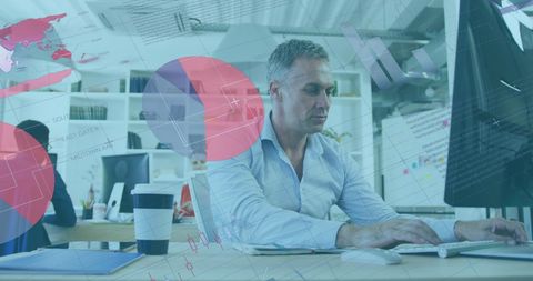 Businessman Analyzing Statistical Data on Computer