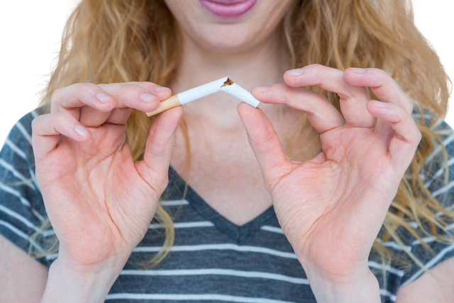 Transparent midsection of blonde woman snapping cigarette - quitting smoking concept - Download Free Stock Videos Pikwizard.com