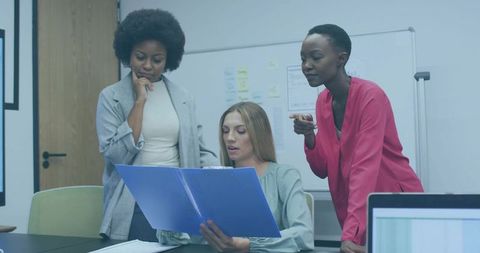 Diverse Women Collaborating in Modern Conference Room