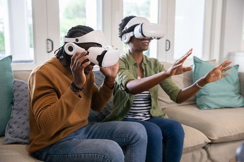 Friends Embracing VR Technology at Home for Gaming Fun