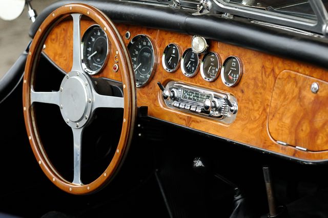 Detail of Classic Car Dashboard with Wooden Steering Wheel - Download Free Stock Photos Pikwizard.com
