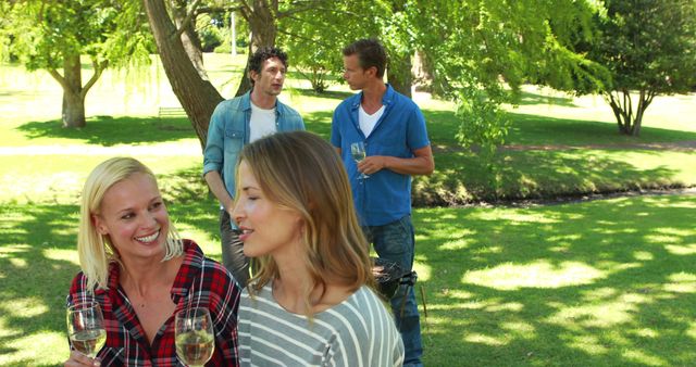 Friends Enjoying Outdoor Barbecue in Sunny Park - Download Free Stock Images Pikwizard.com