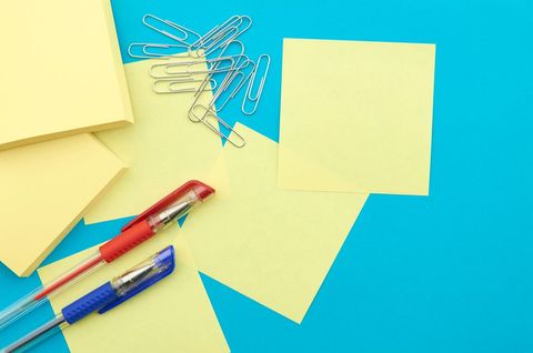 Office supplies on blue desk background for organization