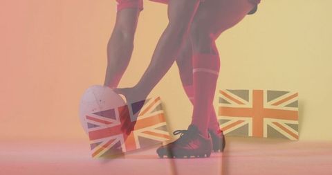 Rugby player setting ball with union jacks
