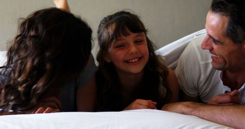 Joyful Family Moment with Child Relaxing at Home