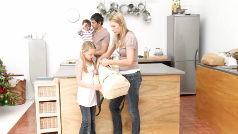 Parents Preparing Children for School in Modern Kitchen