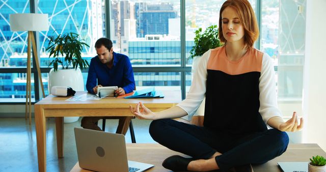 Businesswoman Practicing Meditation in Modern Office - Download Free Stock Images Pikwizard.com