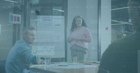 Businesswoman Leading Team Meeting with Charts and Graphs