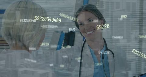 Smiling Female Doctor Consulting Patient with Data Overlay