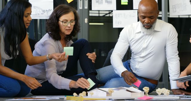 Diverse Team Collaborating on Architectural Project with Sticky Notes - Download Free Stock Images Pikwizard.com