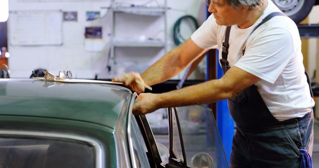 Experienced Mechanic Repairing Vintage Car in Garage - Download Free Stock Images Pikwizard.com