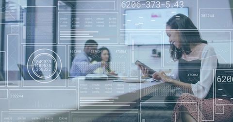 Woman Using Smartphone in Modern Coworking Space with Futuristic Data Interface