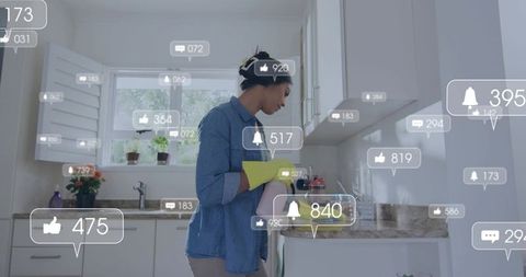 Woman cleaning modern kitchen wearing gloves while social media notification overlays surround her