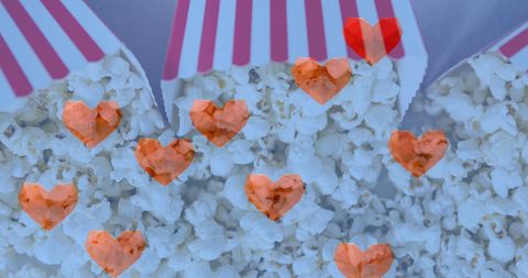 Heart Icons Overlay on Popcorn Boxes for Celebration - Download Free Stock Images Pikwizard.com