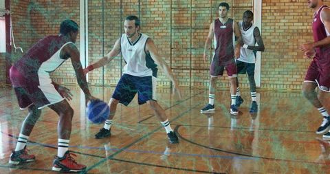Intense Basketball Game in Indoor Gym with Strategic Play