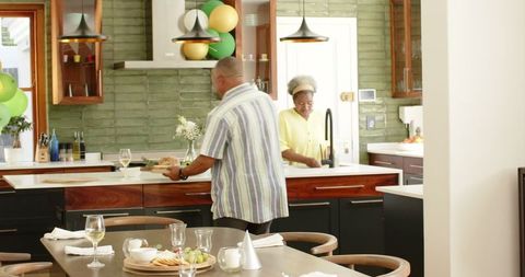 Senior Couple Enjoying Festive Day Together in Modern Kitchen