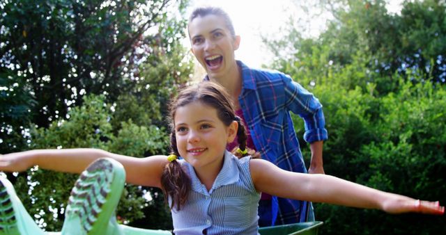 Mother and Daughter Playing in Garden, Joyful Outdoor Activity - Download Free Stock Images Pikwizard.com