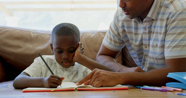 Father Helping Son with Homework on Couch - Download Free Stock Images Pikwizard.com