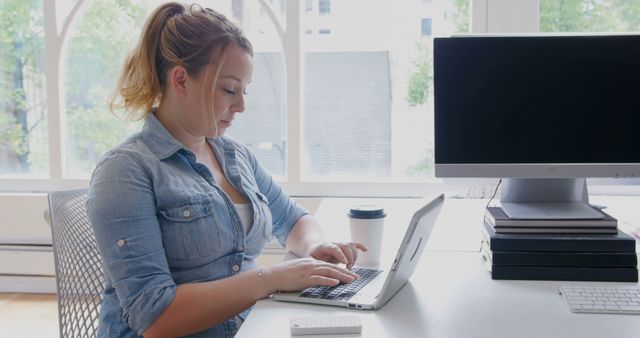 Woman Working on Laptop at Modern Office Desk - Download Free Stock Images Pikwizard.com