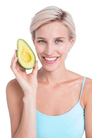 Smiling woman holding avocado showing freshness and health on transparent background