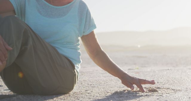 Woman Relaxing on Sandy Beach in Evening Sunlight - Download Free Stock Images Pikwizard.com