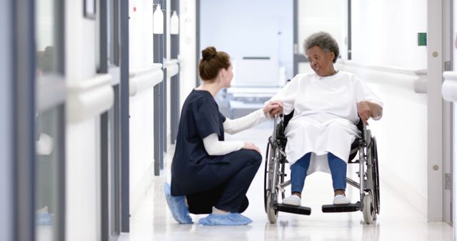 Nurse Assisting Elderly Patient in Hospital Corridor - Download Free Stock Images Pikwizard.com