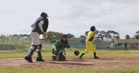 Baseball Players Competing in Action on Field