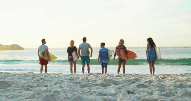 Friends Ready for Surfing on Sandy Beach at Sunset - Download Free Stock Images Pikwizard.com