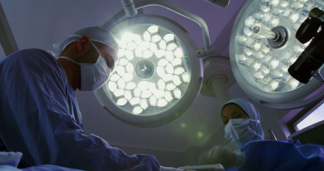 Surgeons Performing Surgery in Operating Room with Surgical Lights - Download Free Stock Images Pikwizard.com