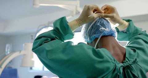 African American Surgeon Prepares for Surgery in Hospital